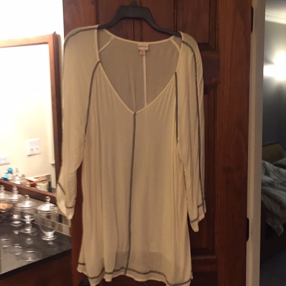 Off white draping top accented in black